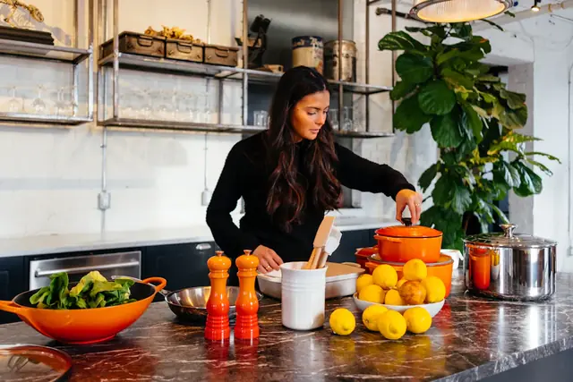 Woman preparing a meal in her kitchen